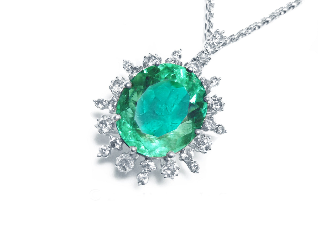 Emerald pendant with halo diamond accents on a white gold chain topside visible