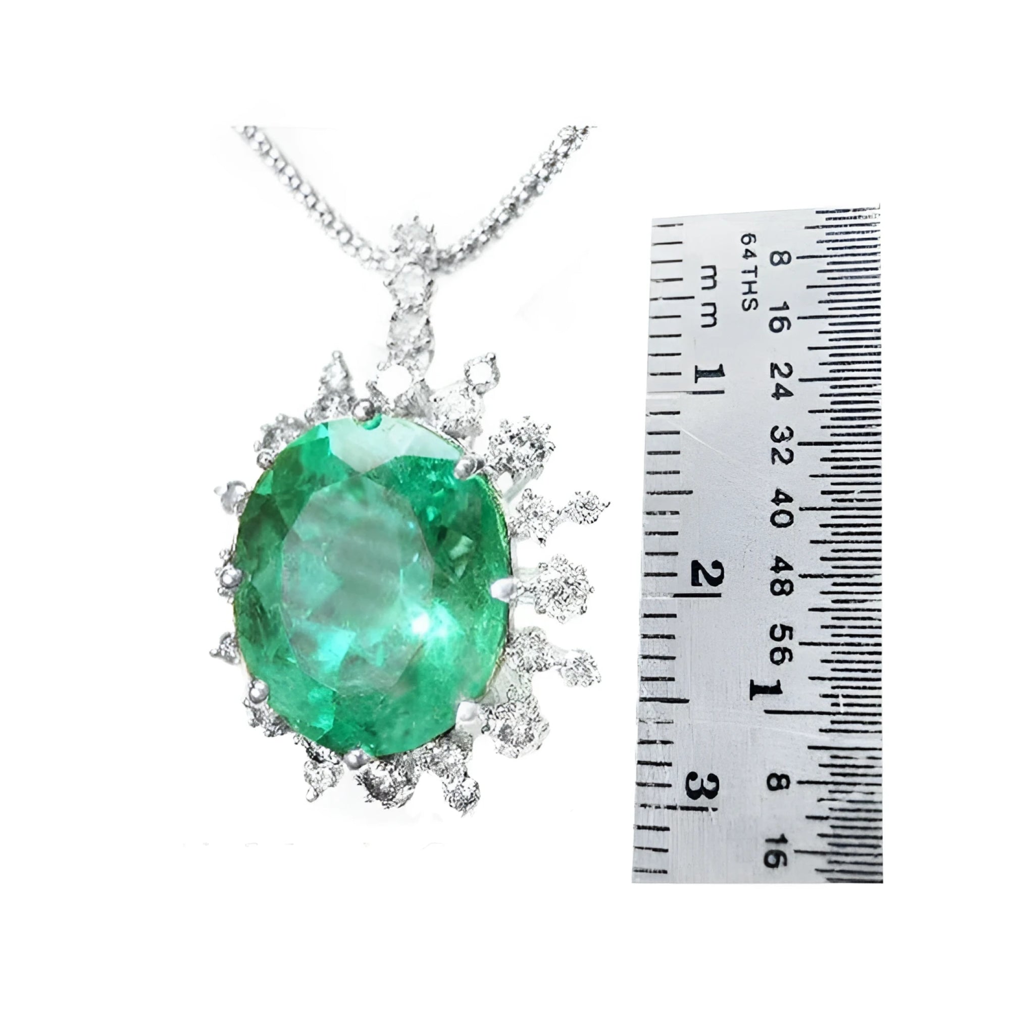 10.91 ct. oval emerald pendant with diamond halo in 14K white gold, shown next to a ruler.