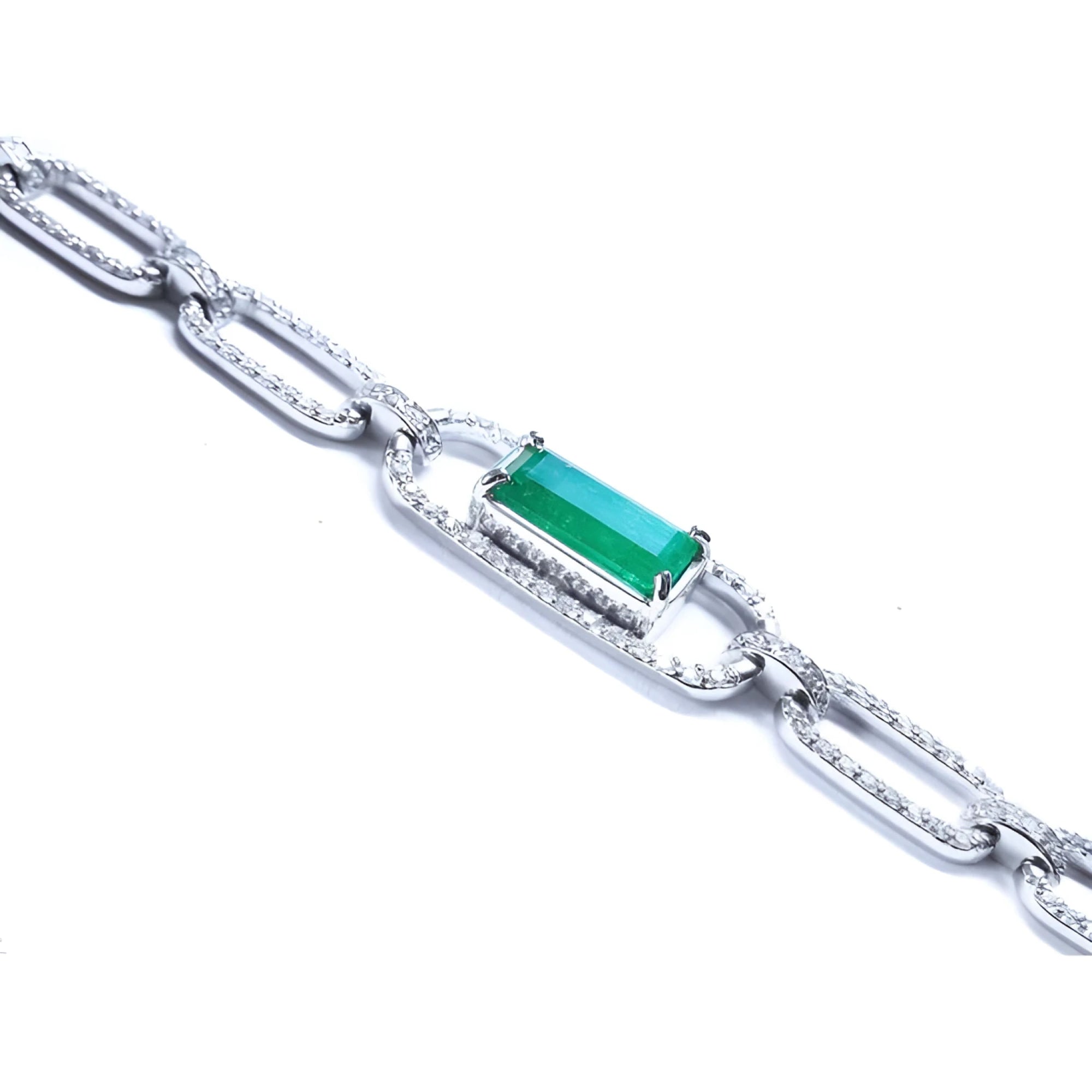 Paperclip style bracelet with an emerald-cut natural emerald crafted in 14k whit gold.
