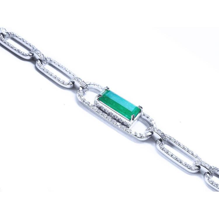 Paperclip style bracelet with an emerald-cut natural emerald crafted in 14k whit gold.