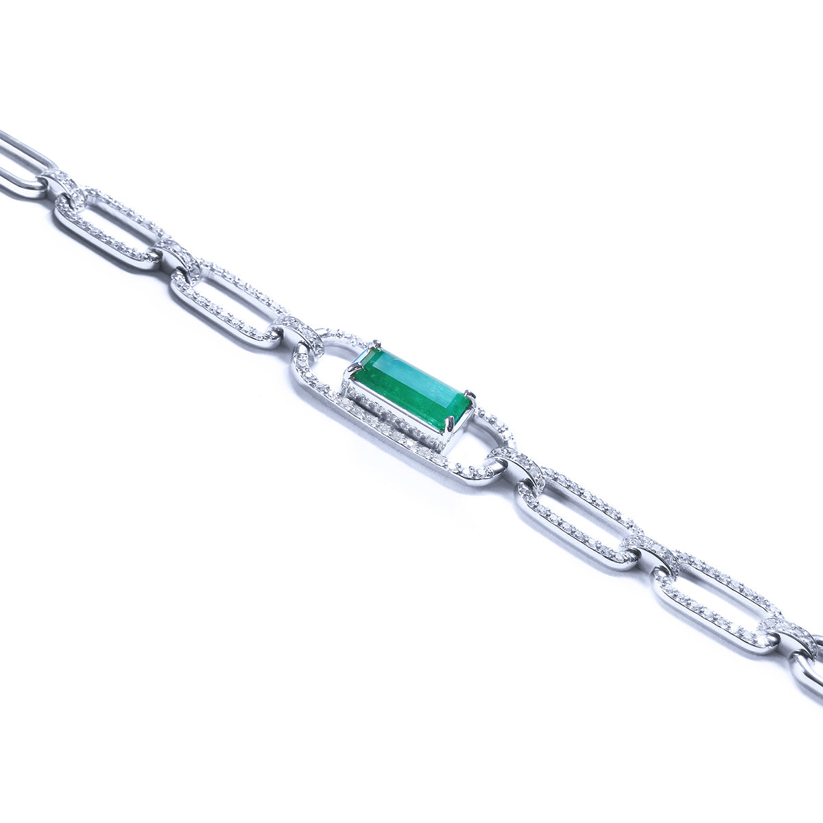 White gold paperclip bracelet with a colombian emerald and diamonds on a lateral view profile.