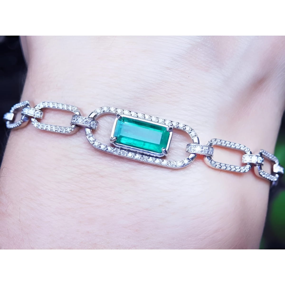 14k White and yellow gold paperclip bracelet with an emerald-cut natural colombian emerald and accent diamonds.