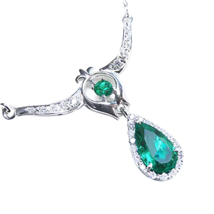 Emerald jewelry necklace pear-shaped Muzo mine vibrant medium-deep green hue, accented by natural diamonds