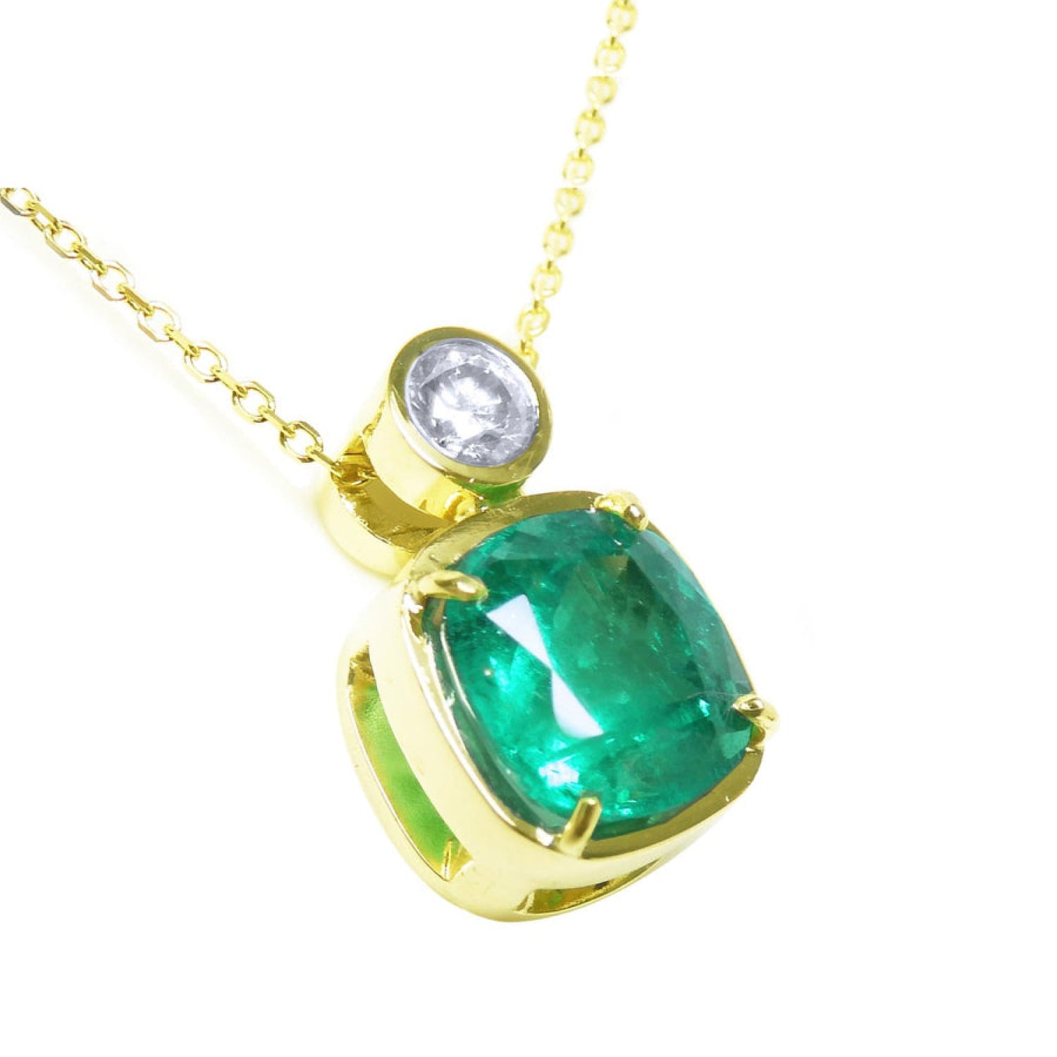 Right side profile of a cushion cut emerald pendant necklace, top and gallery view.