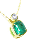 Right side profile of a cushion cut emerald pendant necklace, top and gallery view.
