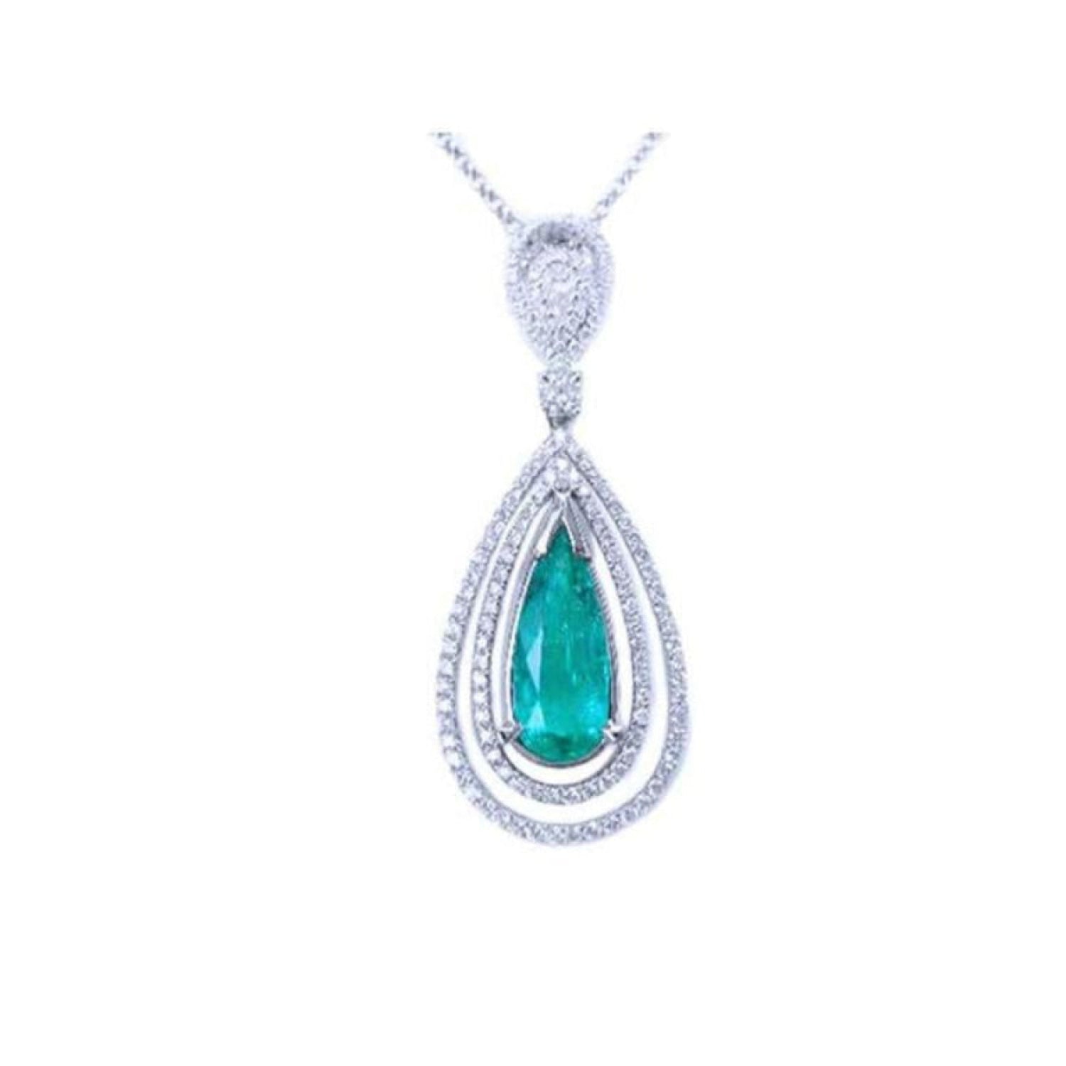 Teardrop emerald pendant with double diamond halo, set in 18K white gold.