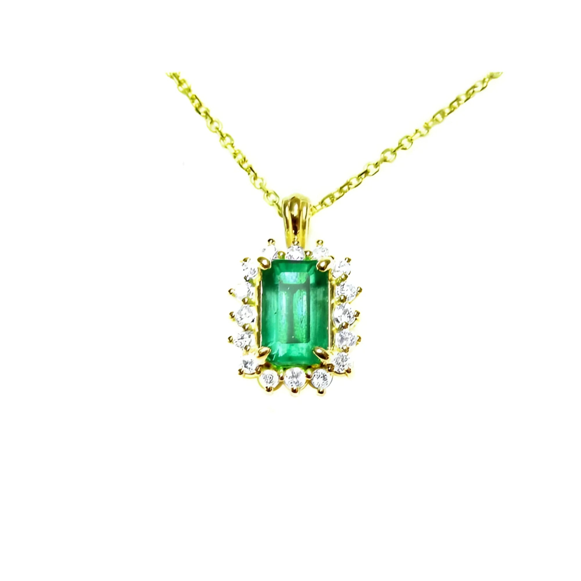 Gold necklace with a rectangular natural colombian emerald with halo diamond pendant on a topside position view.