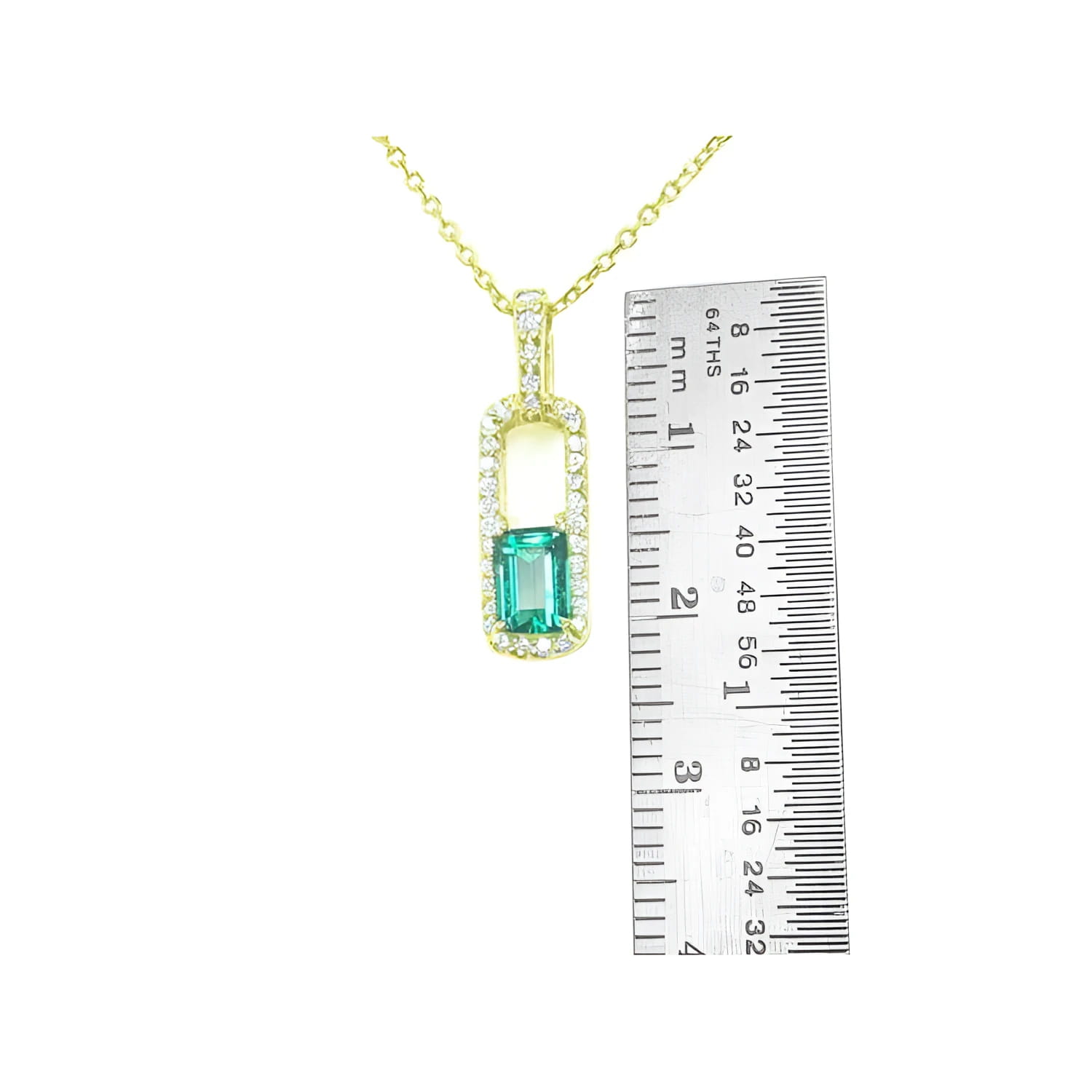 18K yellow gold emerald-cut emerald and diamond halo pendant necklace, shown with ruler for size.