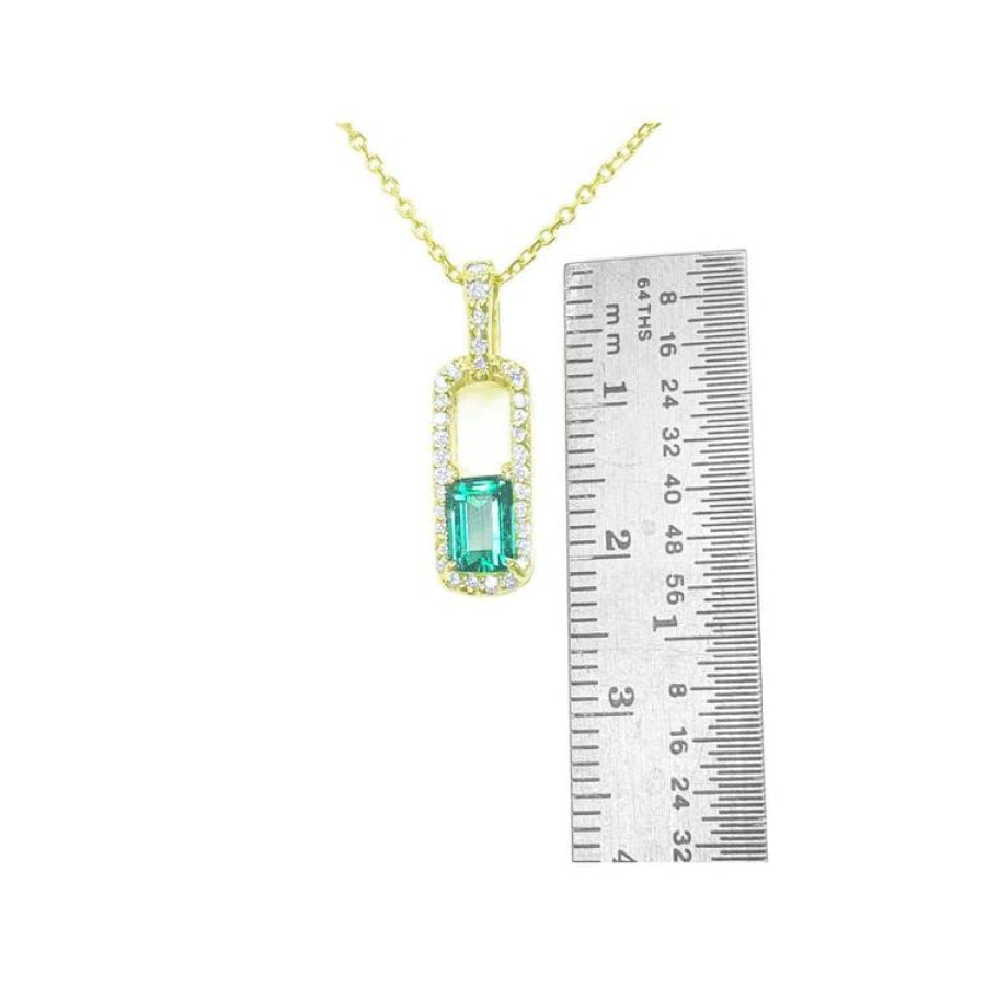 18K yellow gold emerald-cut emerald and diamond halo pendant necklace, shown with ruler for size.