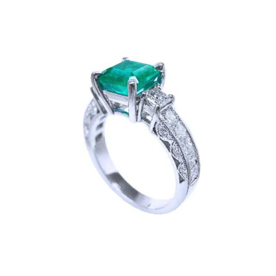 1.62 ct. square emerald ring with princess cut diamonds on a 14K white gold band.