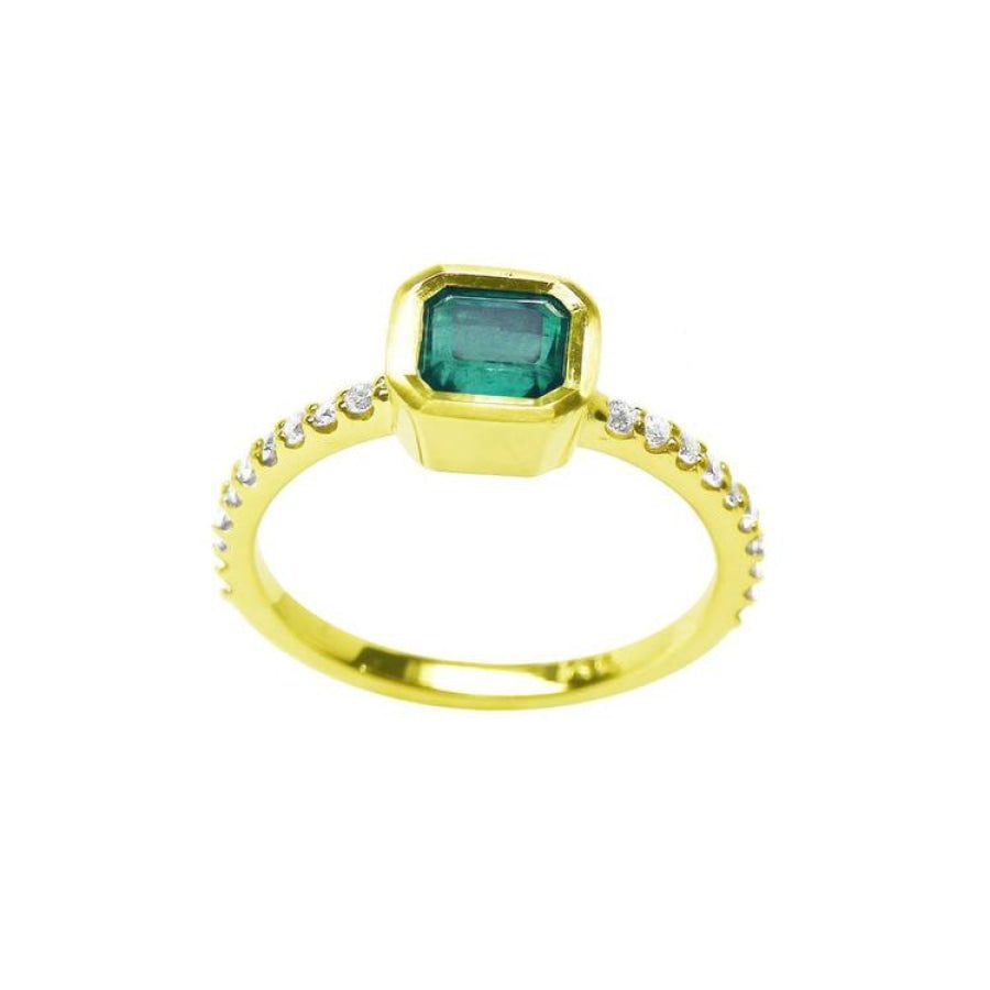 Bezel-set emerald ring with accent diamonds on a 14K yellow gold band.