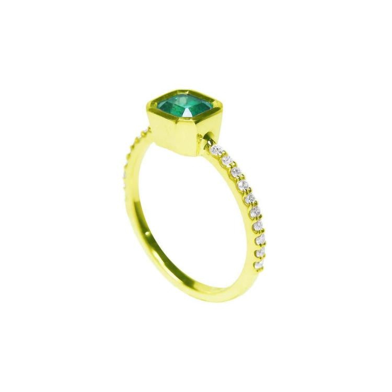 Bezel-set emerald ring with accent diamonds on a 14K yellow gold band.
