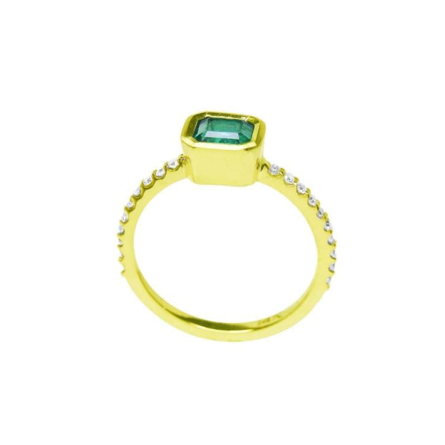 14K yellow gold ring with a bezel-set emerald and accent diamonds on the band.