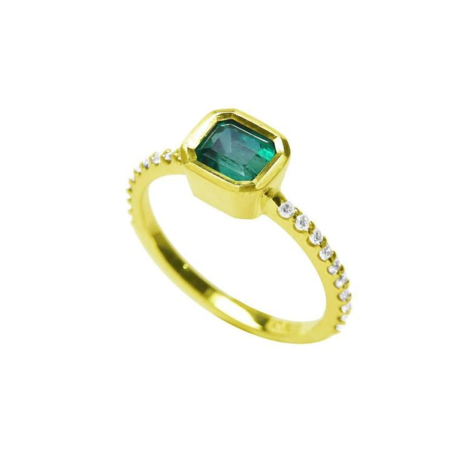 14K yellow gold ring with a bezel-set emerald and accent diamonds on the band.