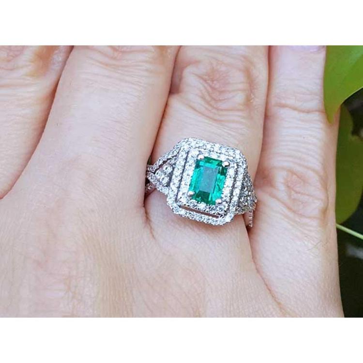 Emerald ring with double halo of natural diamonds and matching band 14k white gold.