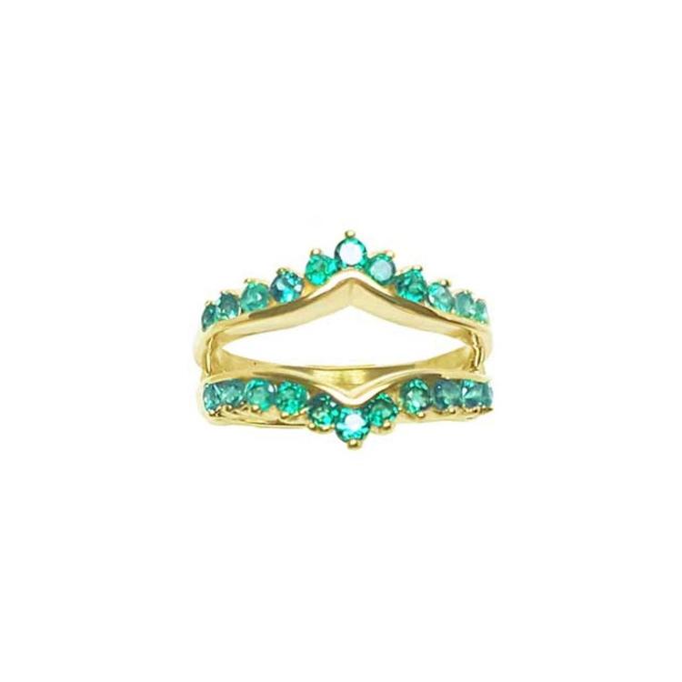 The topside view of an emerald ring guard in yellow gold.