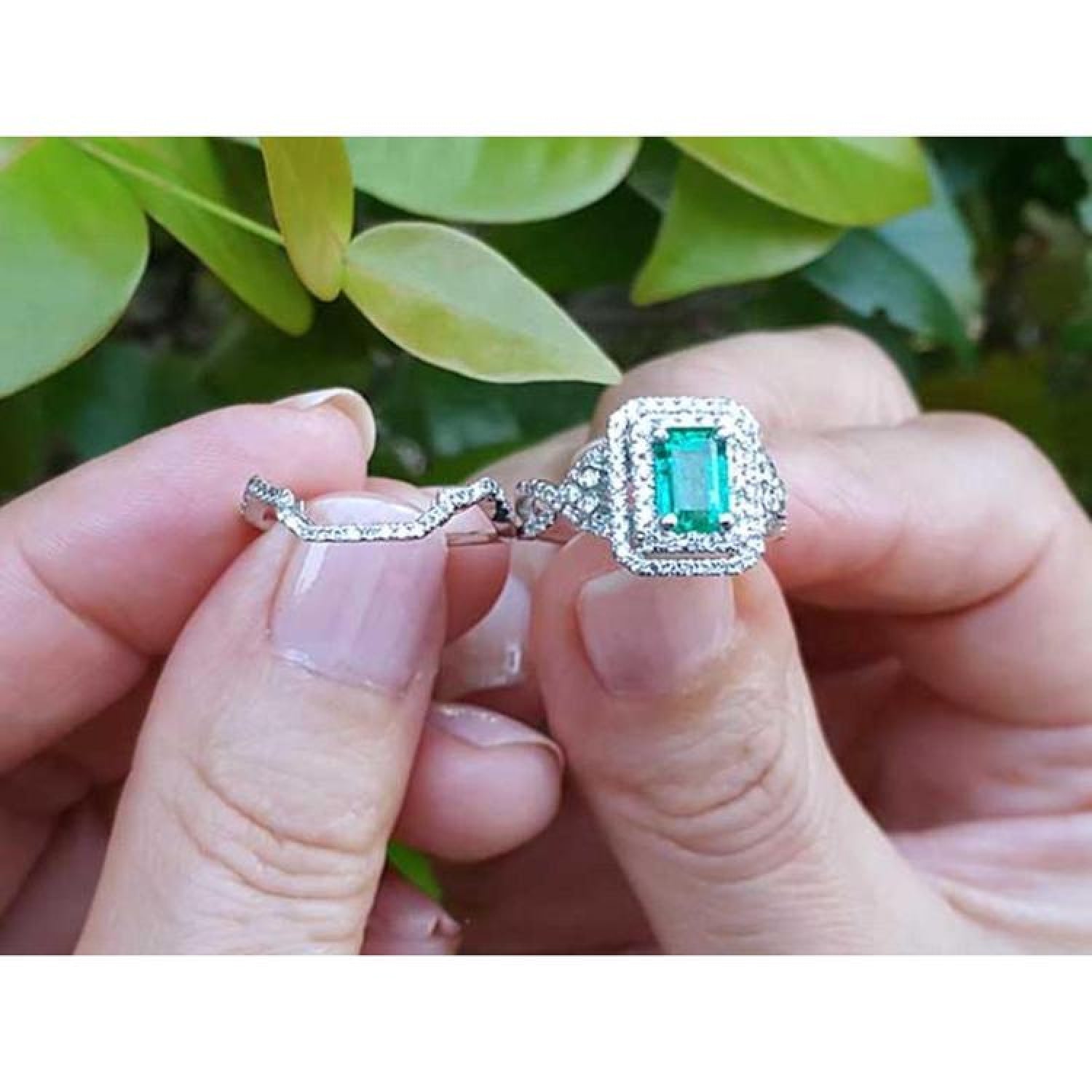 1.01 carat emerald ring with double halo diamonds and matching band in 14K white gold.