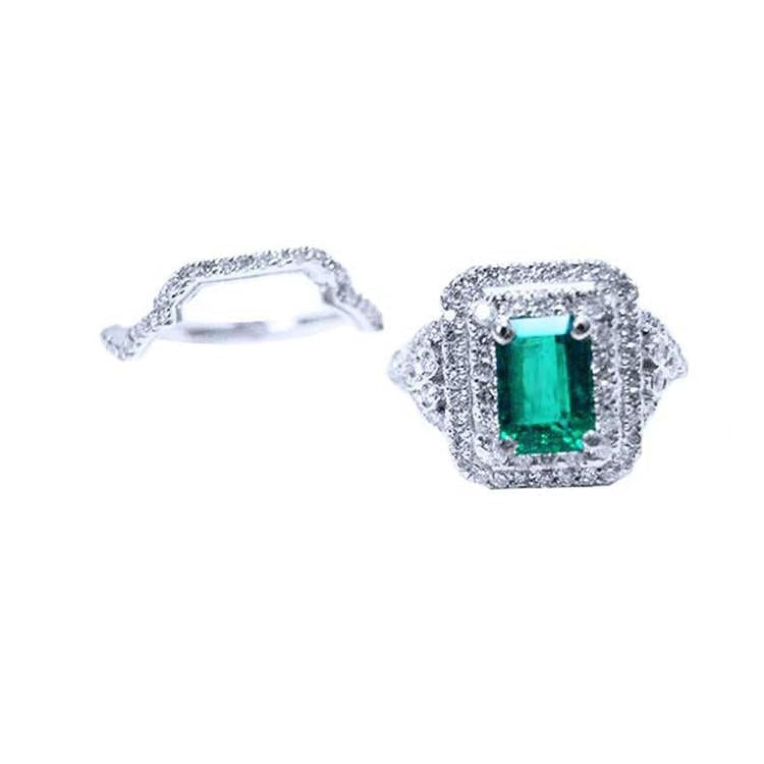 1.01 carat emerald ring with double halo diamonds and matching diamond band in 14K white gold.