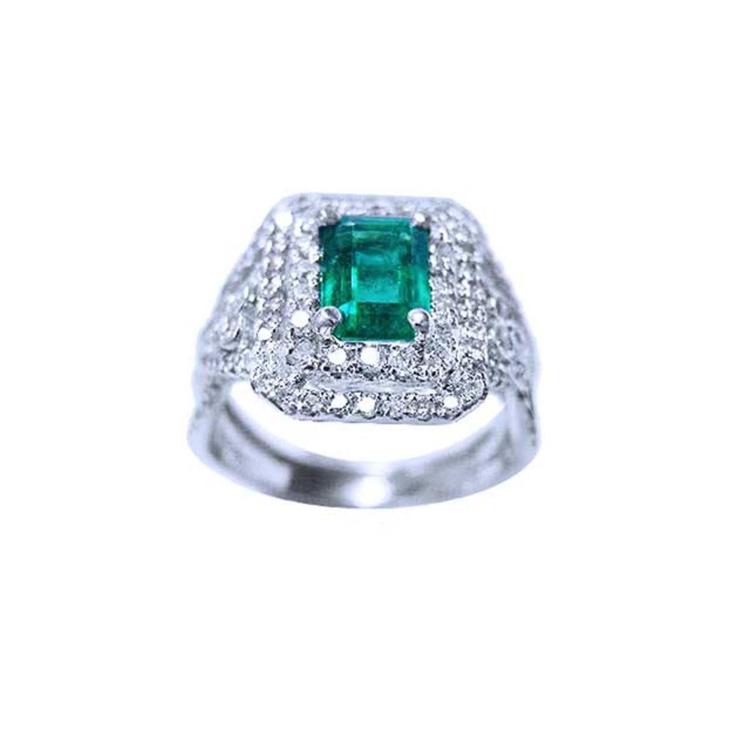 1.01 carat emerald ring with double halo diamonds and matching band in 14K white gold.