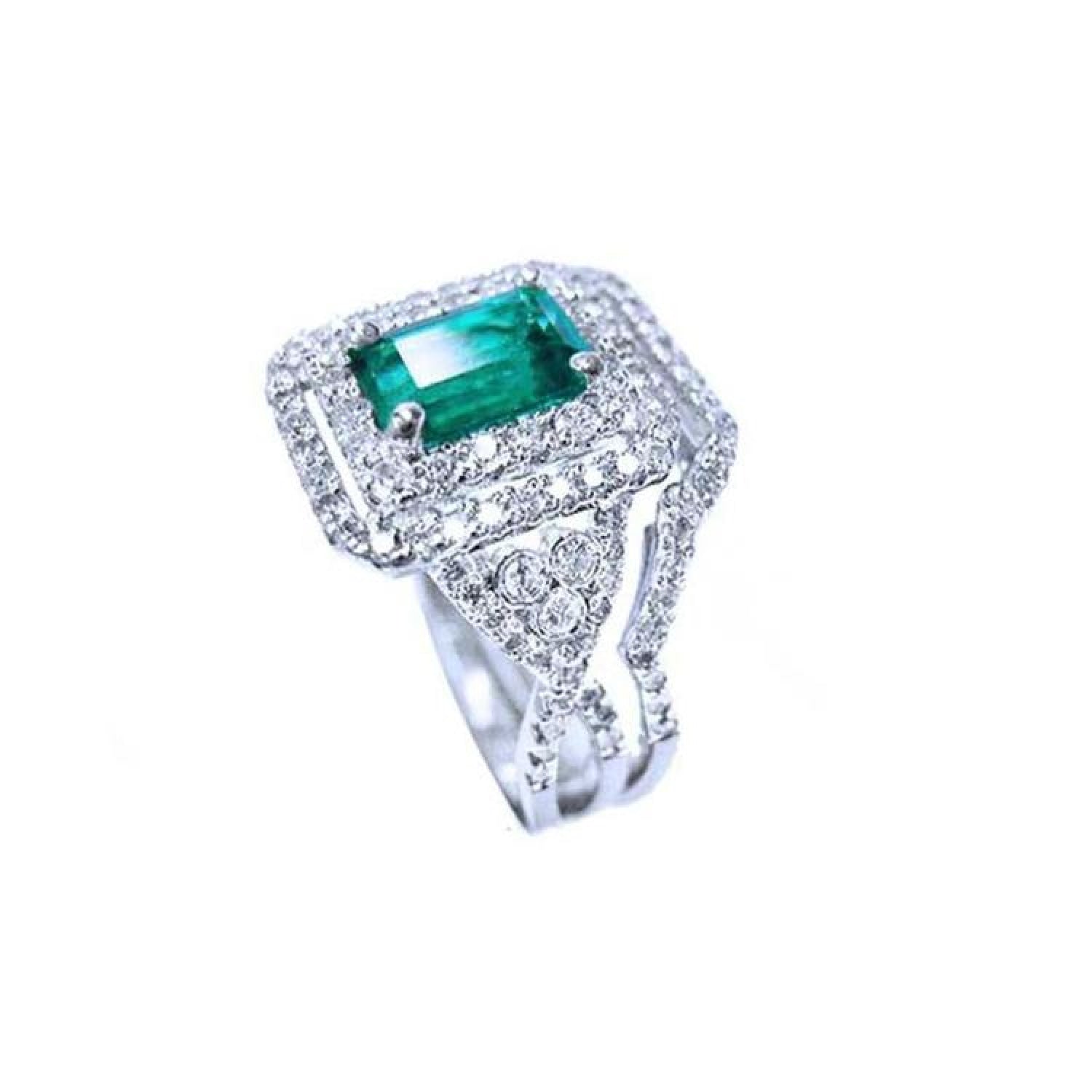1.01 carat emerald ring with double halo diamonds and matching band in 14K white gold.