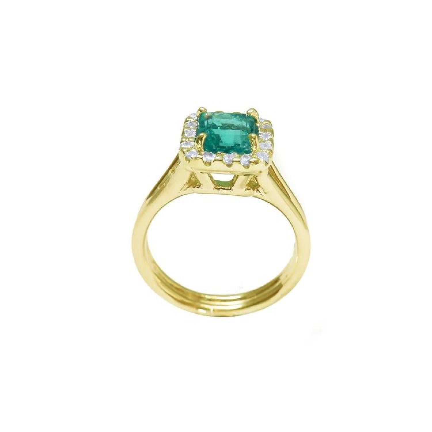 14K yellow gold ring with a square-cut Colombian emerald haloed by diamonds on a split shank.
