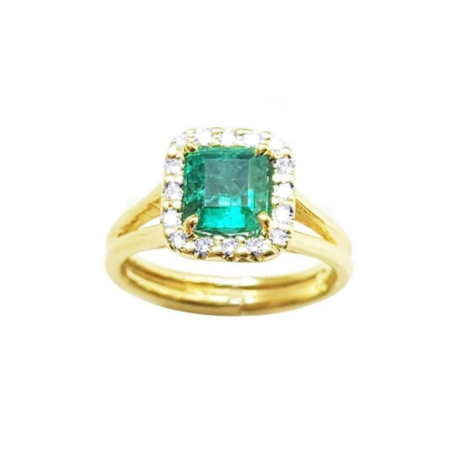 Halo diamond natural colombian emerald ring displayed with both sides profile in yellow gold.