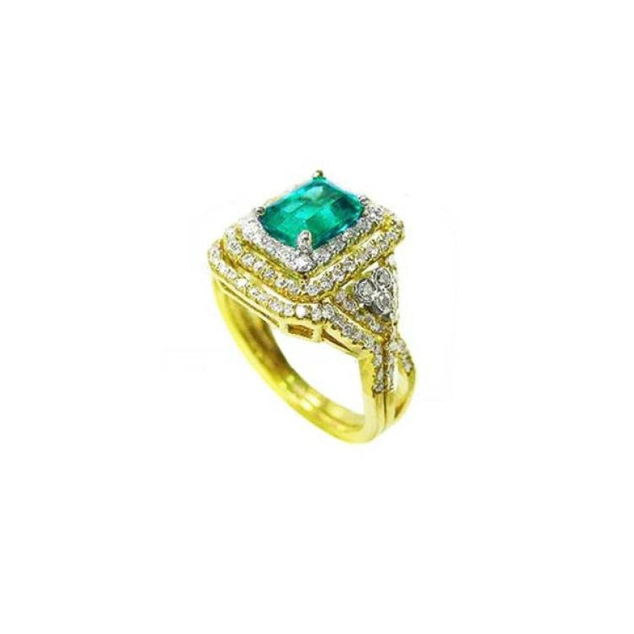 1.31 ct. emerald-cut emerald ring with double diamond halo and matching band in 14K yellow gold.