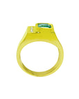 Yellow gold ring for men with a bezel set emerald on a lateral side view position.