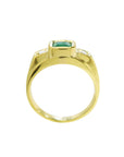 Gold mens ring with emerald on a lateral side view white background
