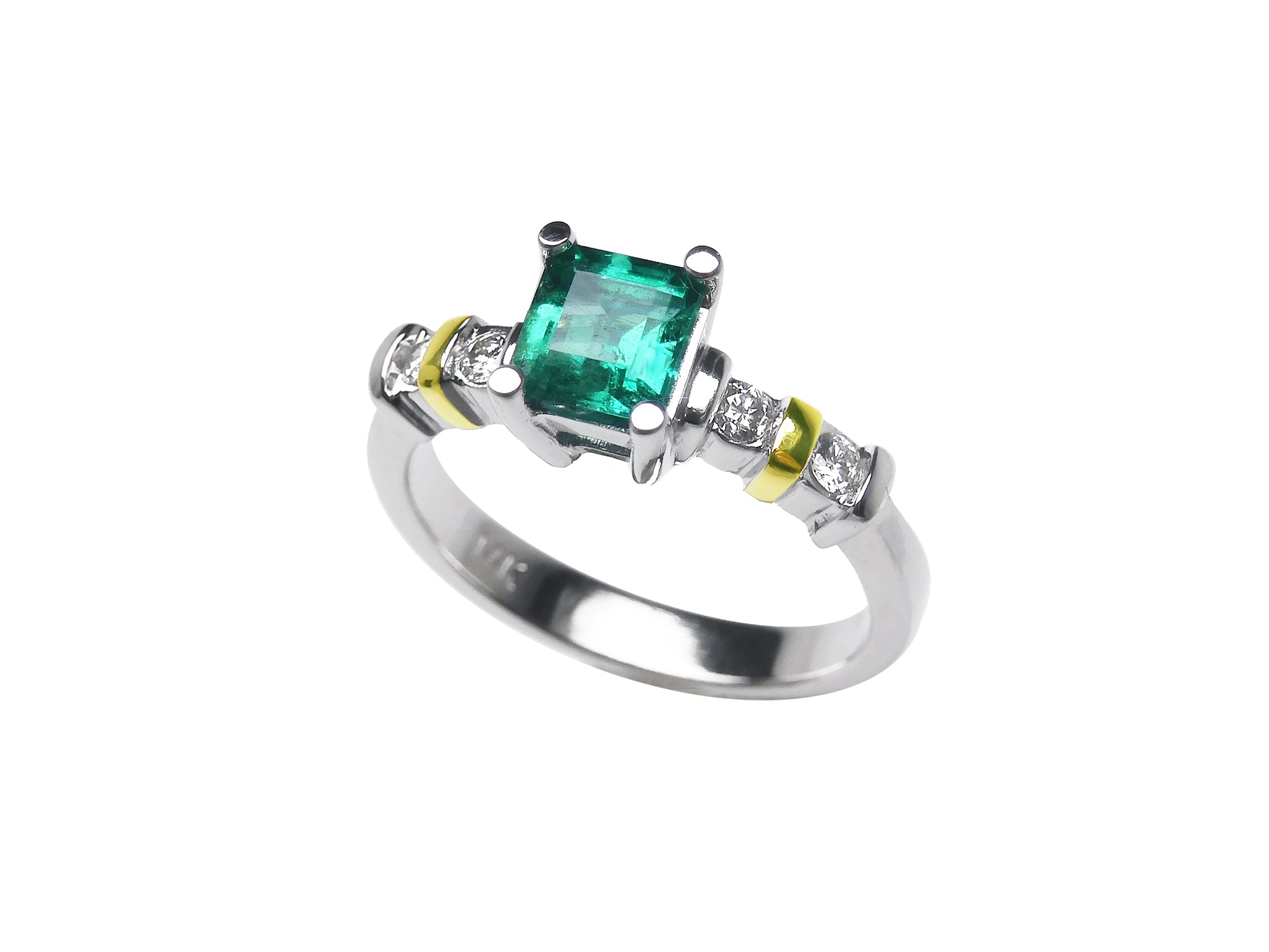 topside profile of a square emerald and accent diamonds white gold ring.