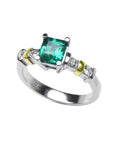 topside profile of a square emerald and accent diamonds white gold ring.