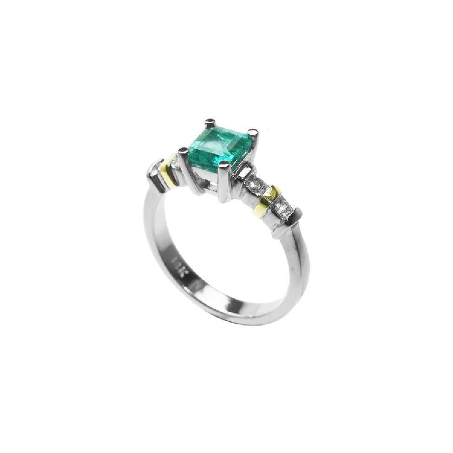 14K white gold ring with a square emerald cut Colombian emerald and side accent diamonds.