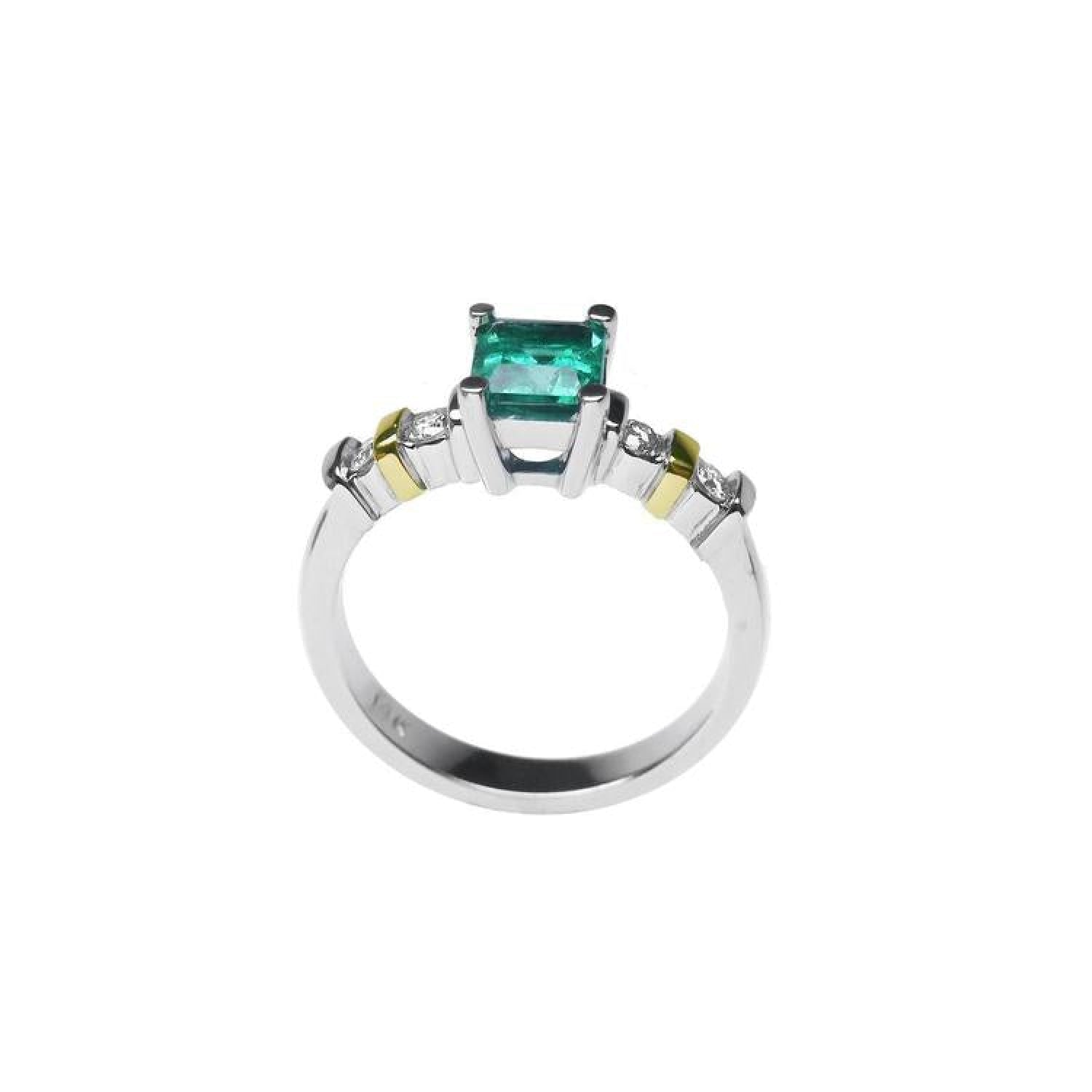 14K white gold ring with a square emerald cut Colombian emerald and side diamonds.