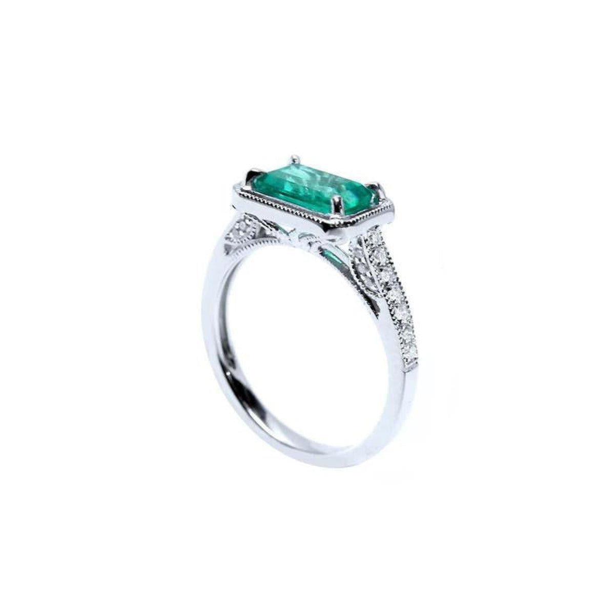 1.21 ct emerald-cut emerald ring with natural diamonds set in 14K white gold.