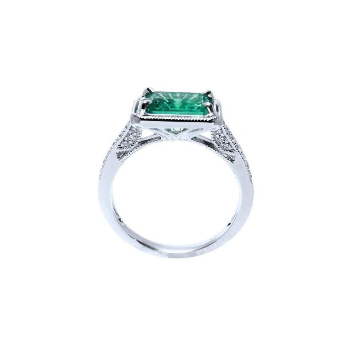 1.21 ct. emerald-cut emerald ring with natural diamonds set in 14K white gold.