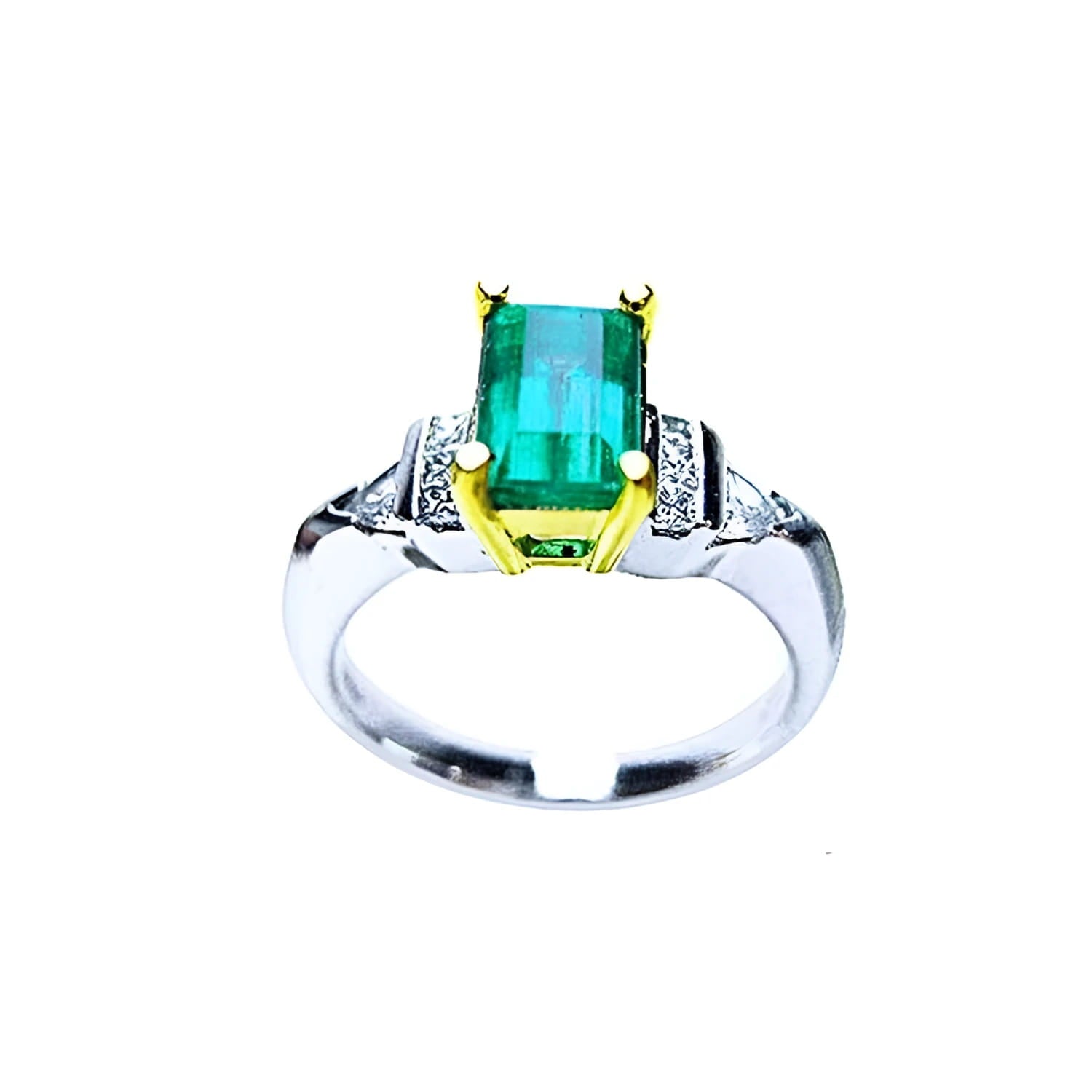 Platinum and 18K yellow gold ring with a 1.21 ct. emerald and natural diamond accents.