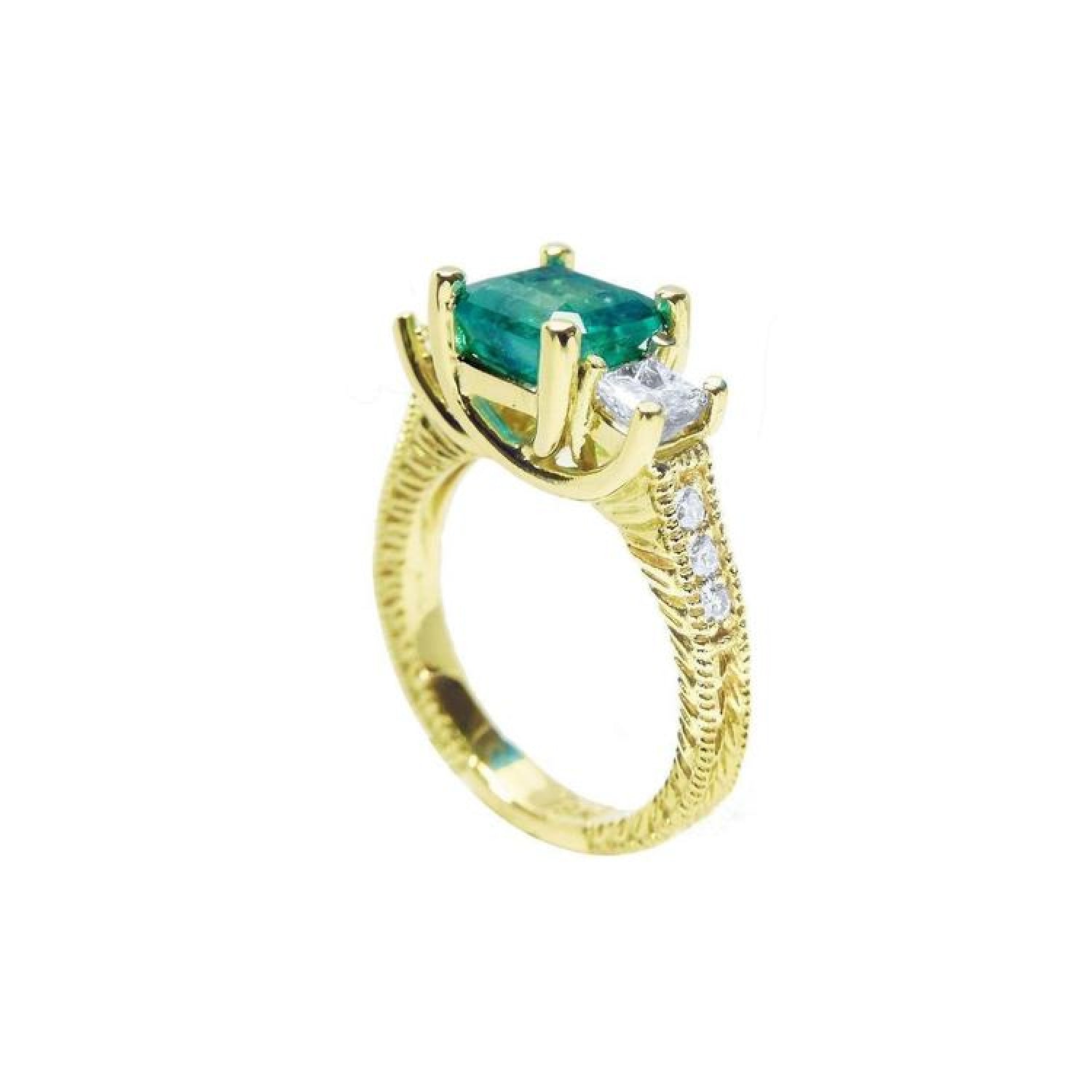 Yellow gold 18K ring with emerald cut emerald and princess cut side diamonds, antique decor.