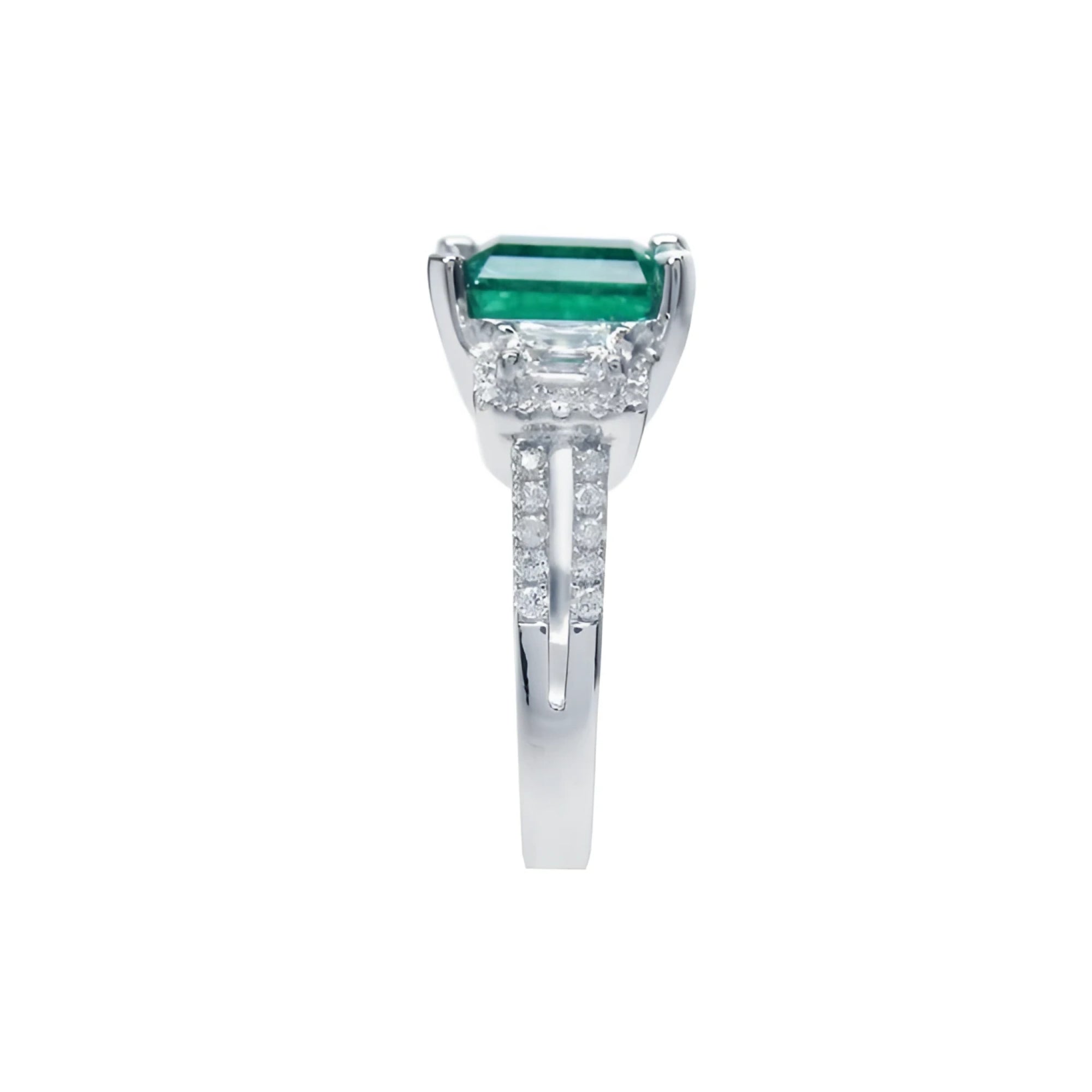 1.88 carat emerald ring with side emerald-cut diamonds and round diamonds set in 18k white gold.