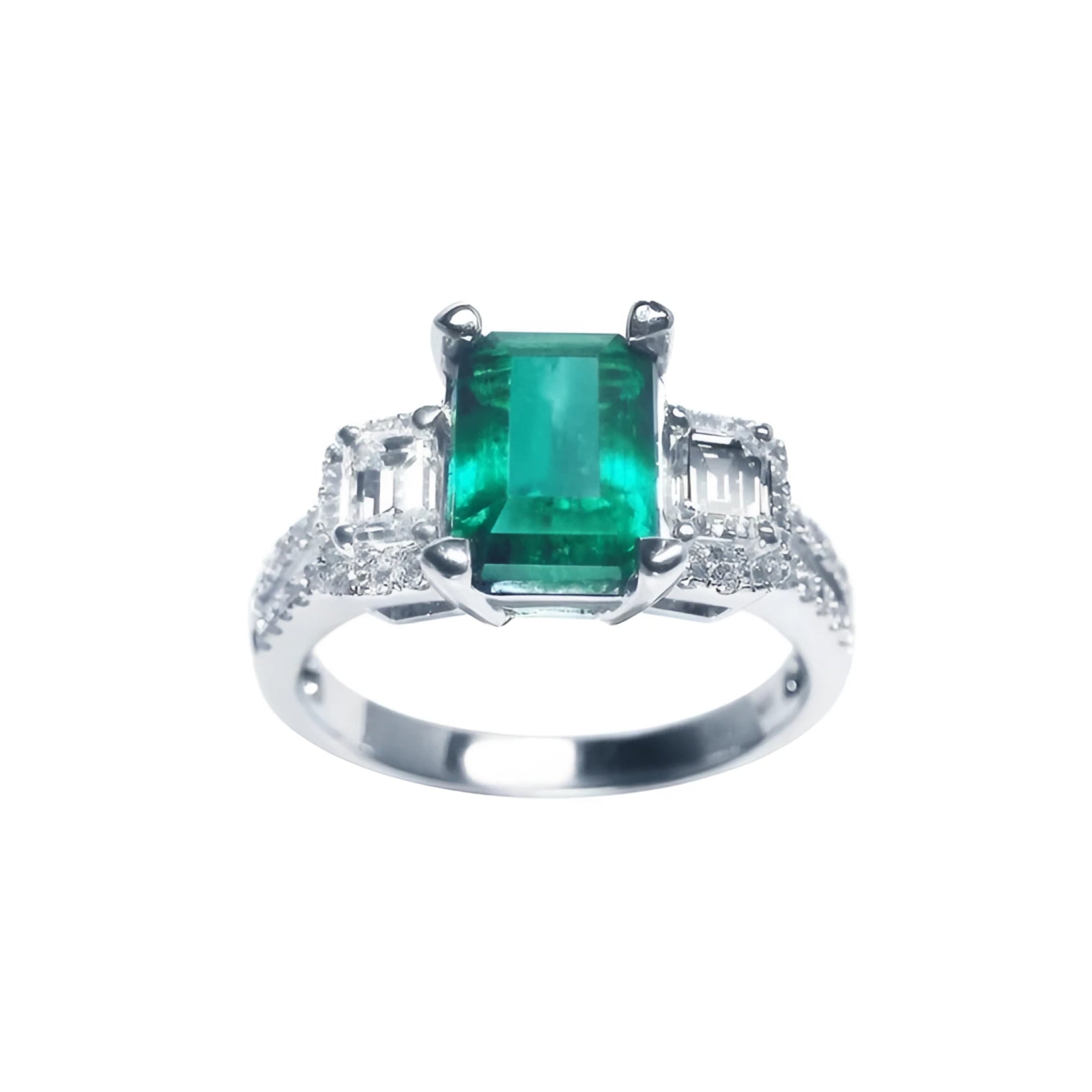 A tree stone emerald engagement ring with side emerald-cut natural side diamonds made of 18k white gold.