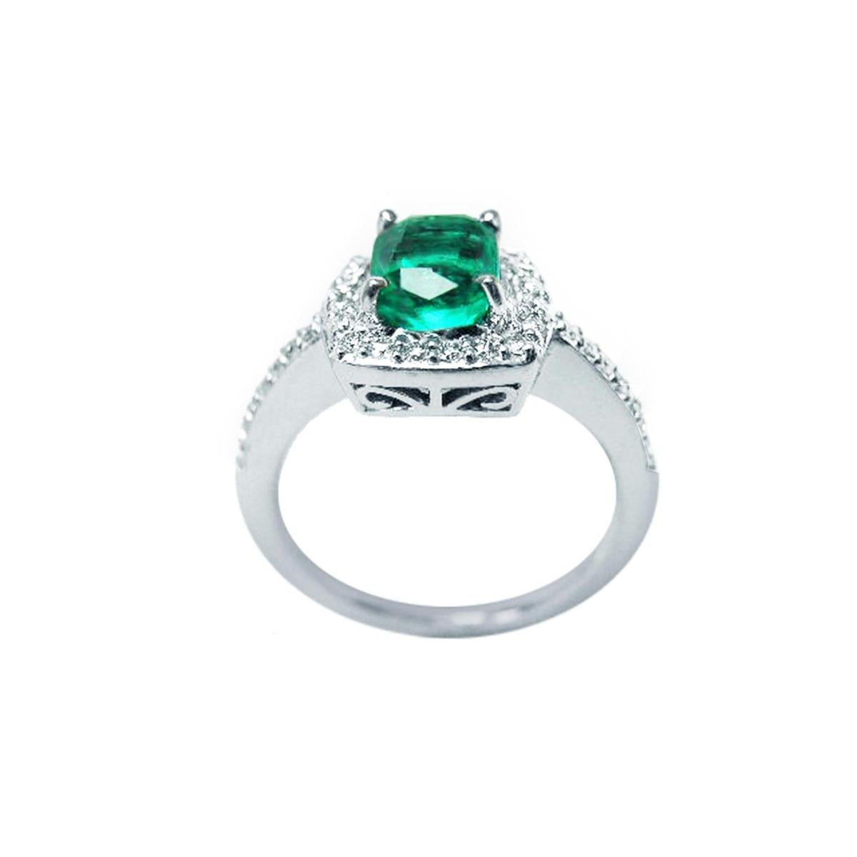 The semilateral view of this cushion cut emerald ring shows the top and gallery profile.