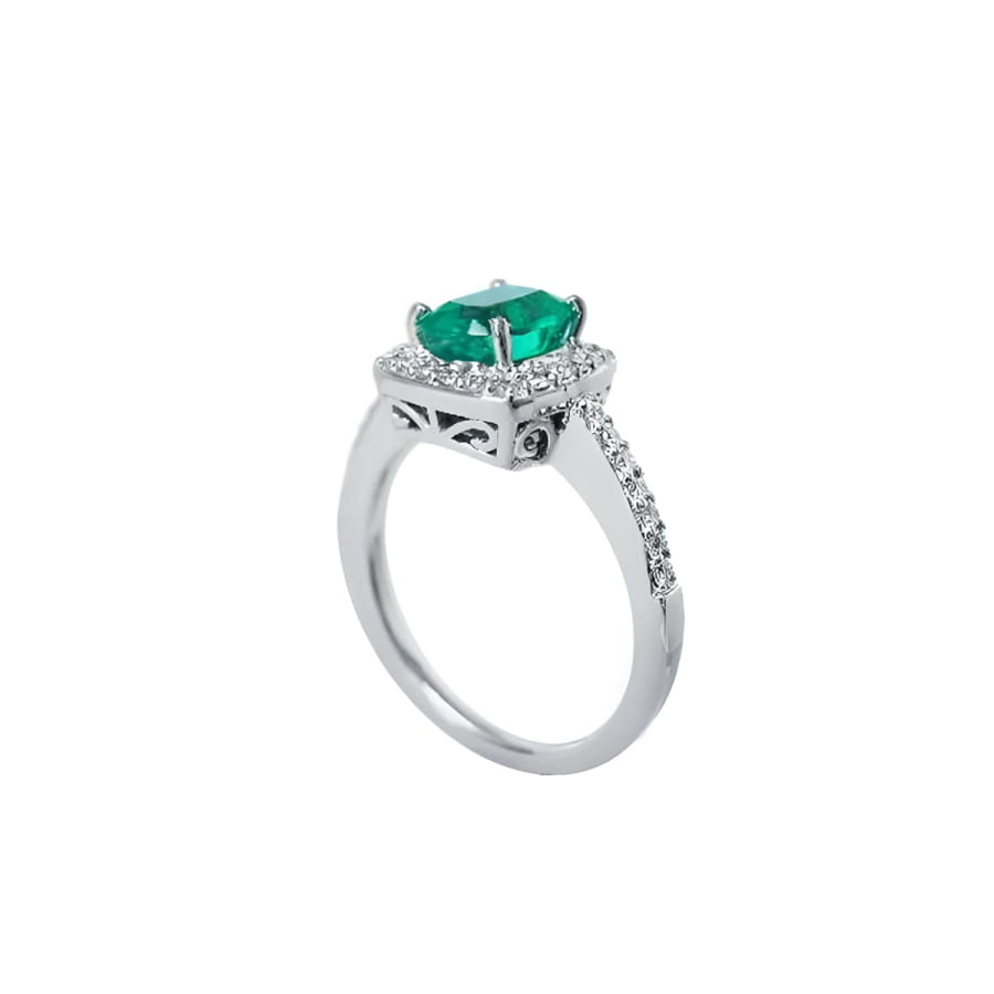 Women's 14K white gold ring with a cushion-cut emerald and diamond halo.
