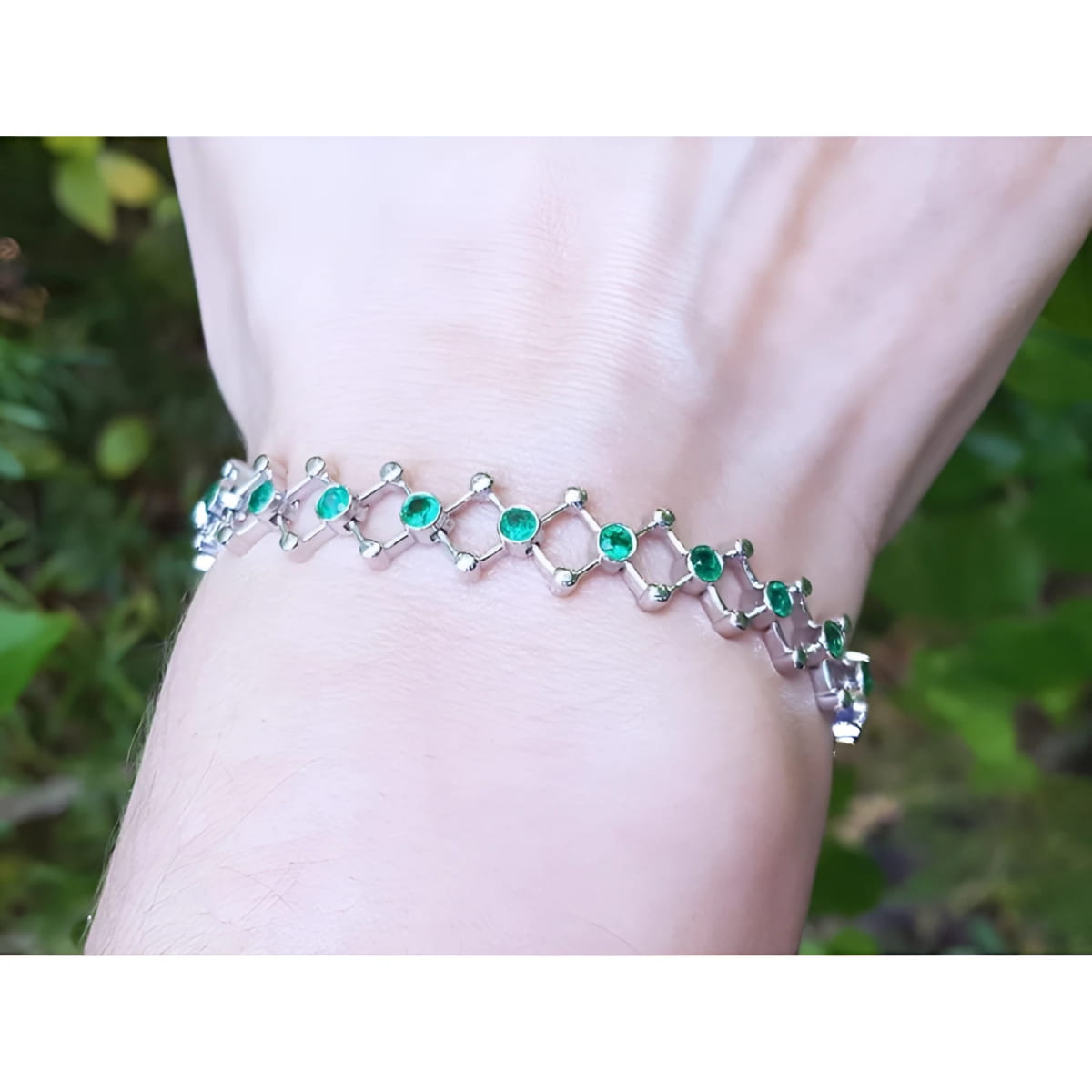 Emerald bracelet for women round cut natural Colombian emeralds crafted in 14k white gold.