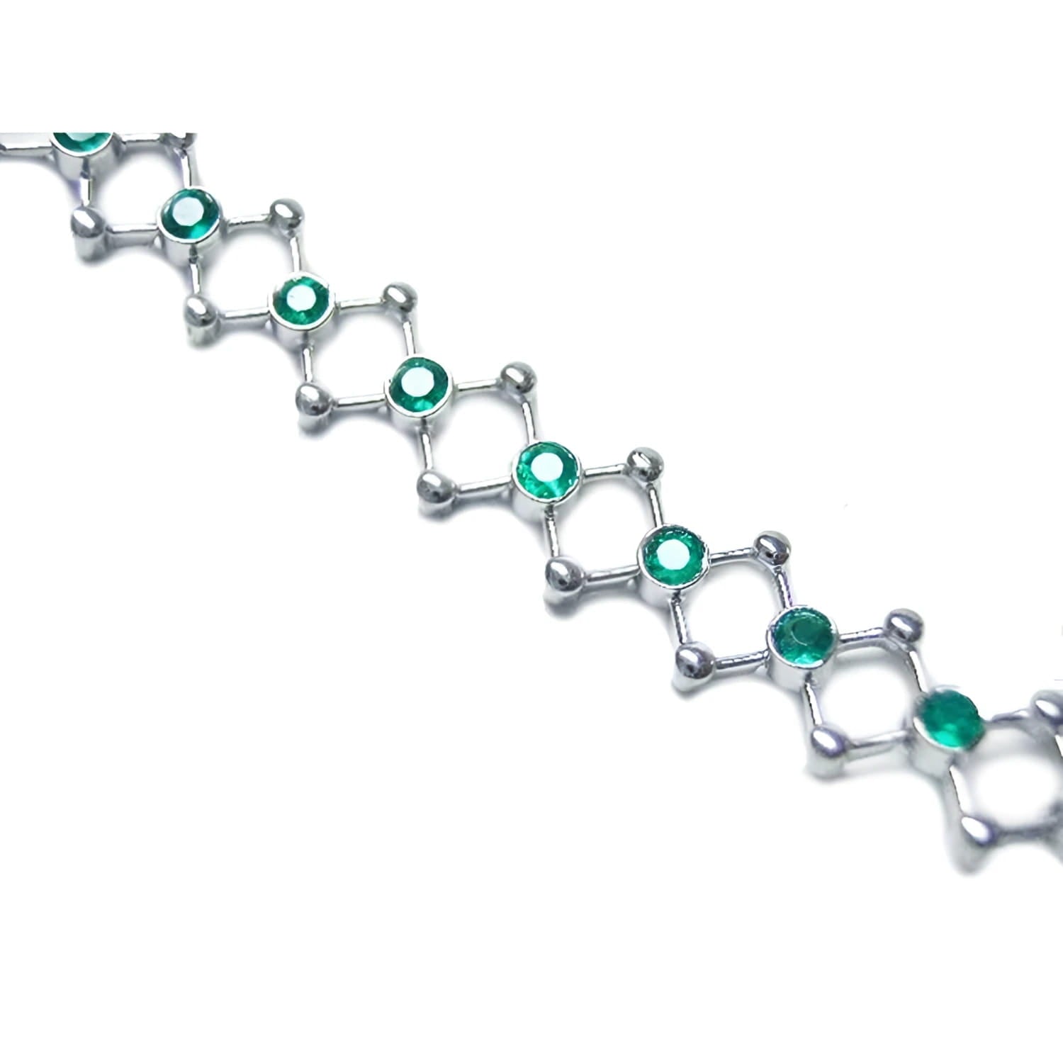 14K white gold bracelet with round cut Colombian emeralds bezel set in diamond-shaped links.