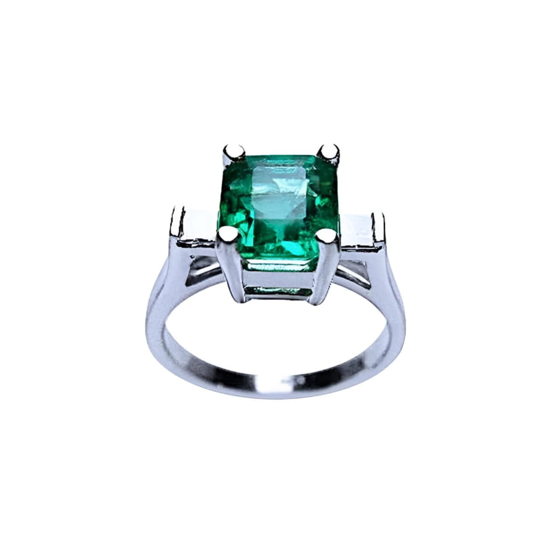 A GIA certified 1.56 ct emerald ring with princess-cut side diamonds in 14K white gold.
