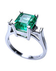 This colombian emerald ring displays the top and partial lateral side.