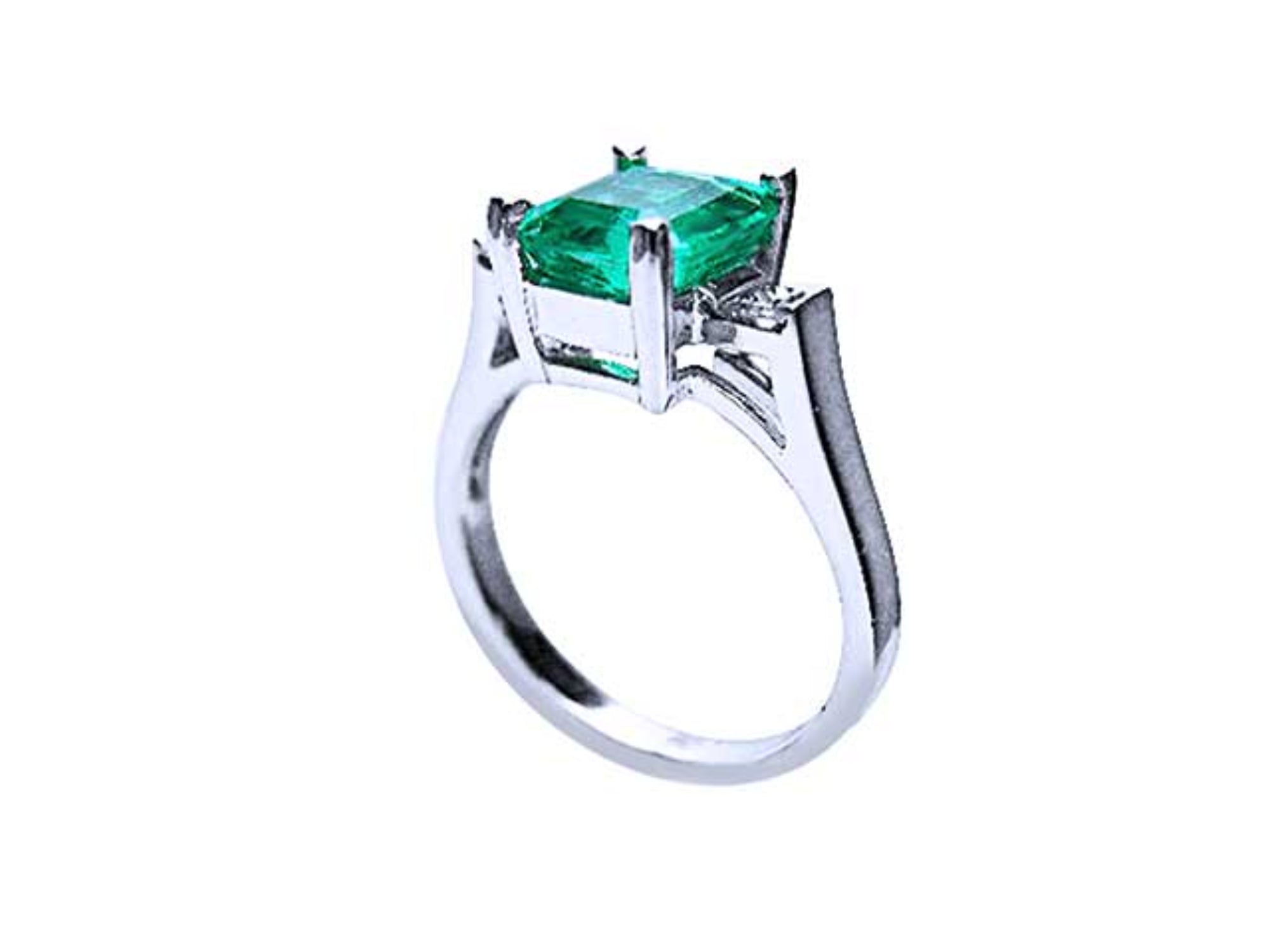 Showcasing the top emerald setting, gallery, and band of a Colombian emerald ring.