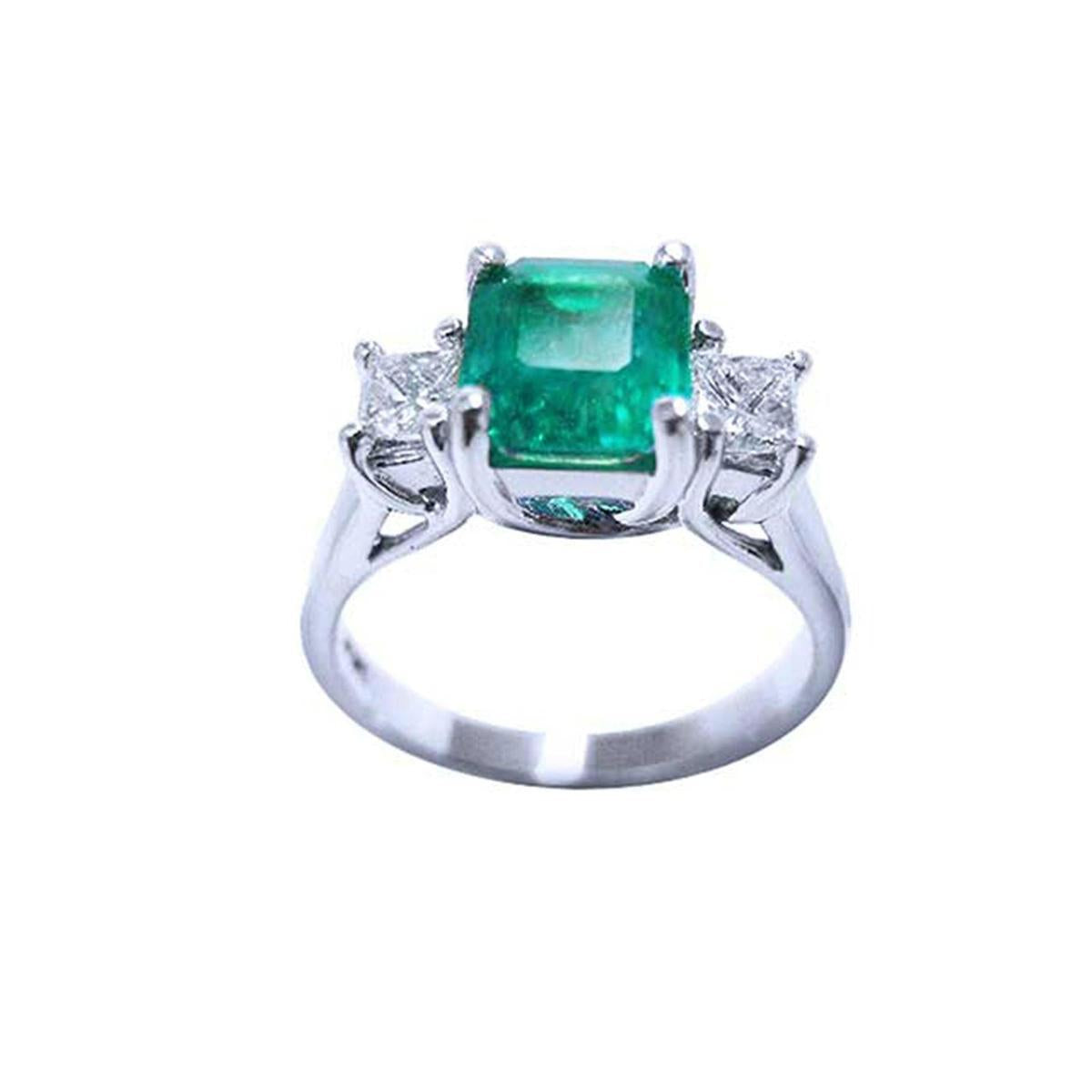This emerald and princess cut side diamonds ring displays the top and gallery view profile.