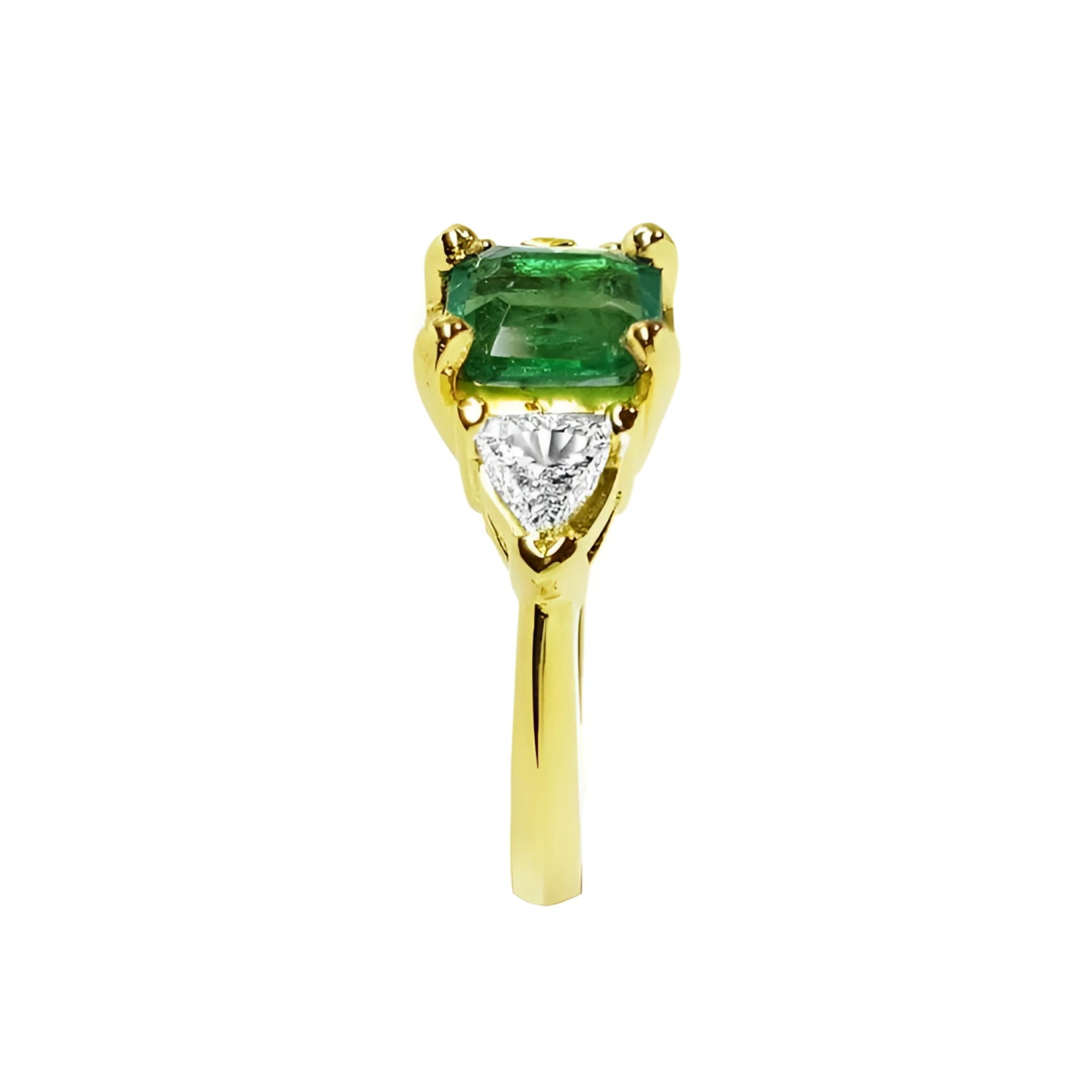 1.51 ct. emerald and trillion-cut diamonds ring in 18k yellow gold.