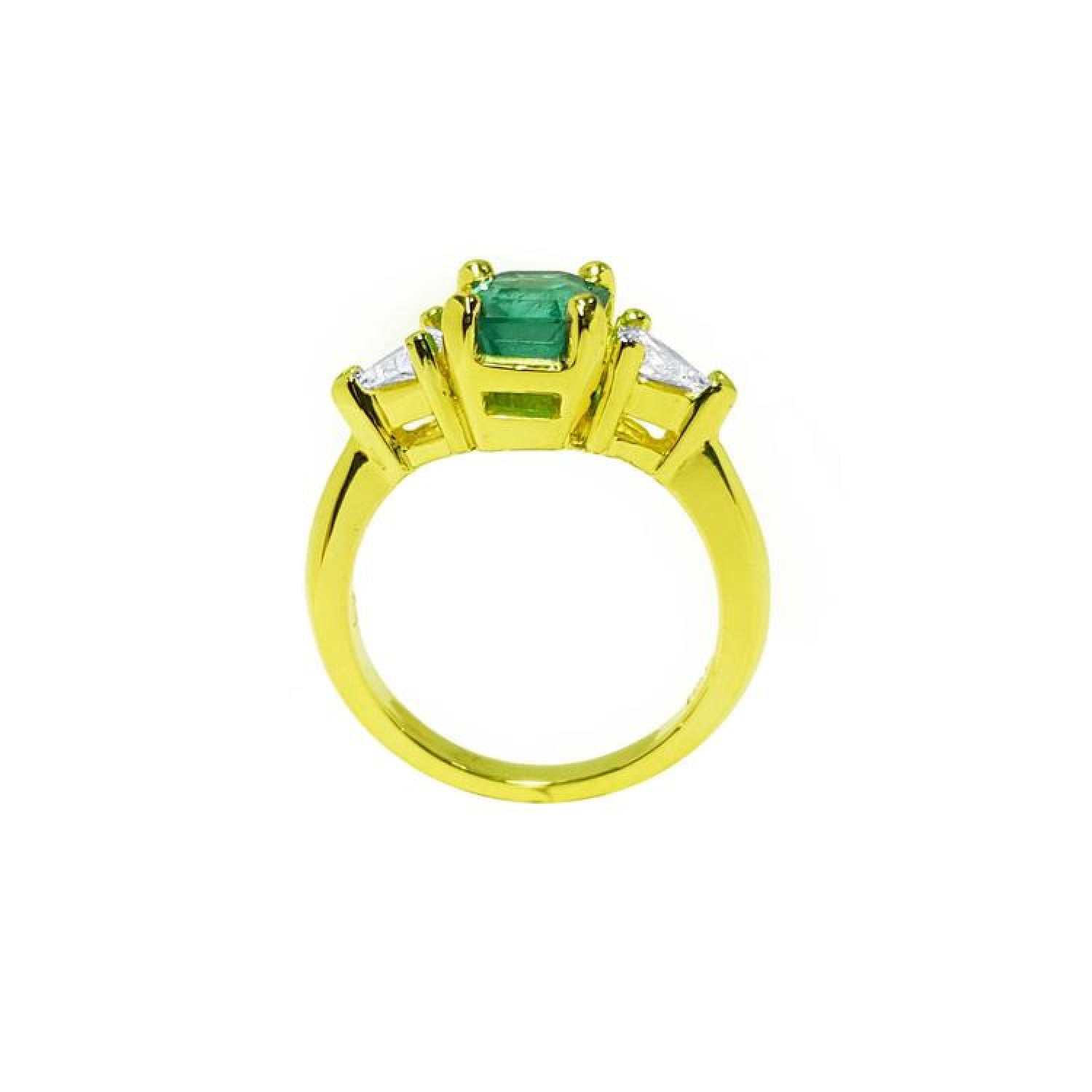 18k gold ring with a 1.51 ct. emerald and two trillion-cut side diamonds.