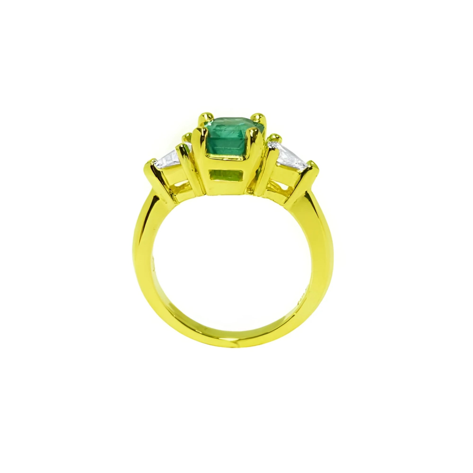 18k gold ring with a 1.51 ct. emerald and two trillion-cut side diamonds.